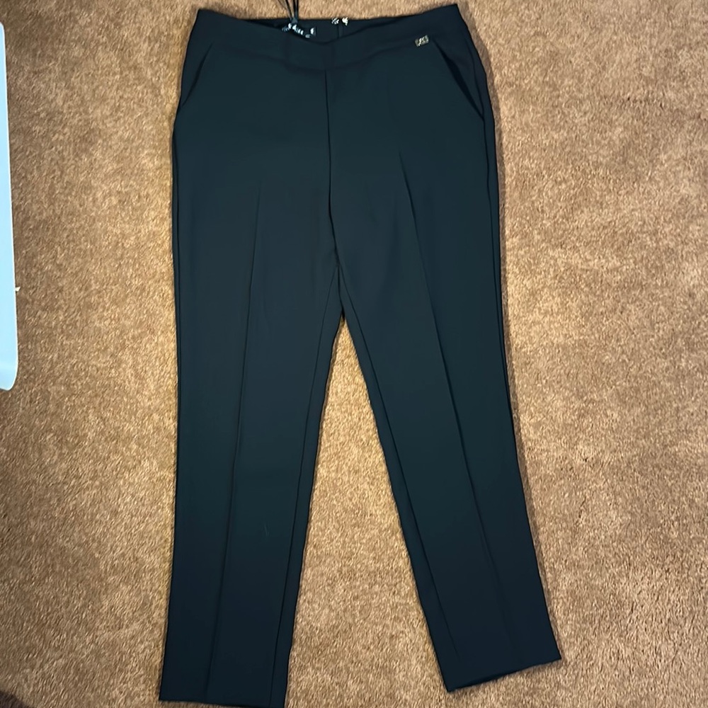 NWT. Women’s black dress pants from divedivine . Size 44.